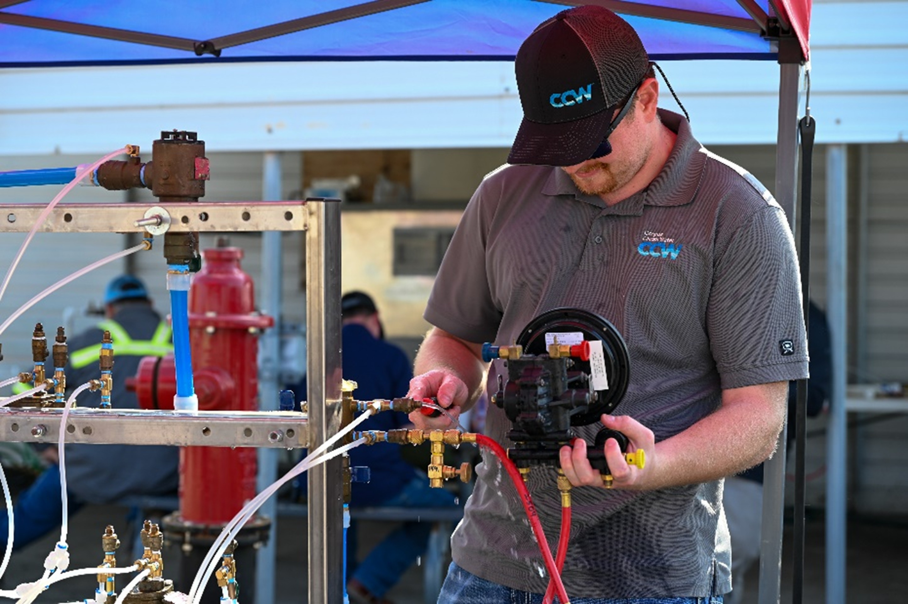 CCW Employee monitors equipment