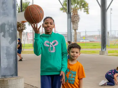 girl and boy with basketball