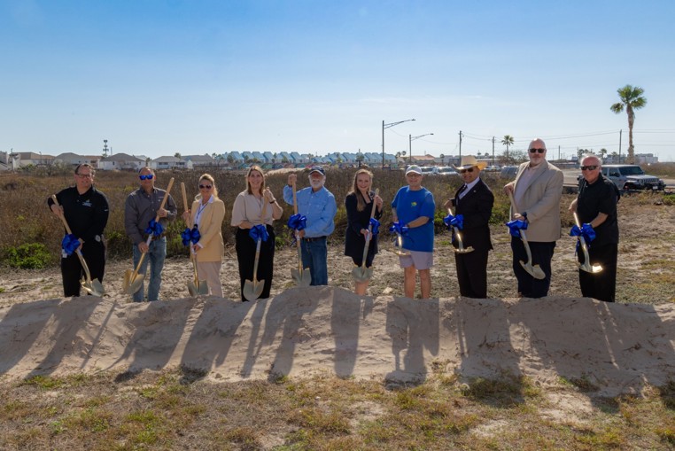 Photo of groundbreaking with shovels.