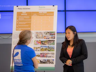 Women Talking at Community Meeting