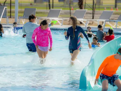 kids walking through pool