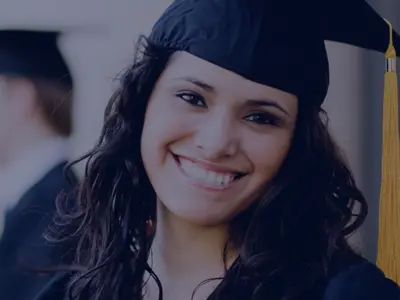 Young woman in cap and gown