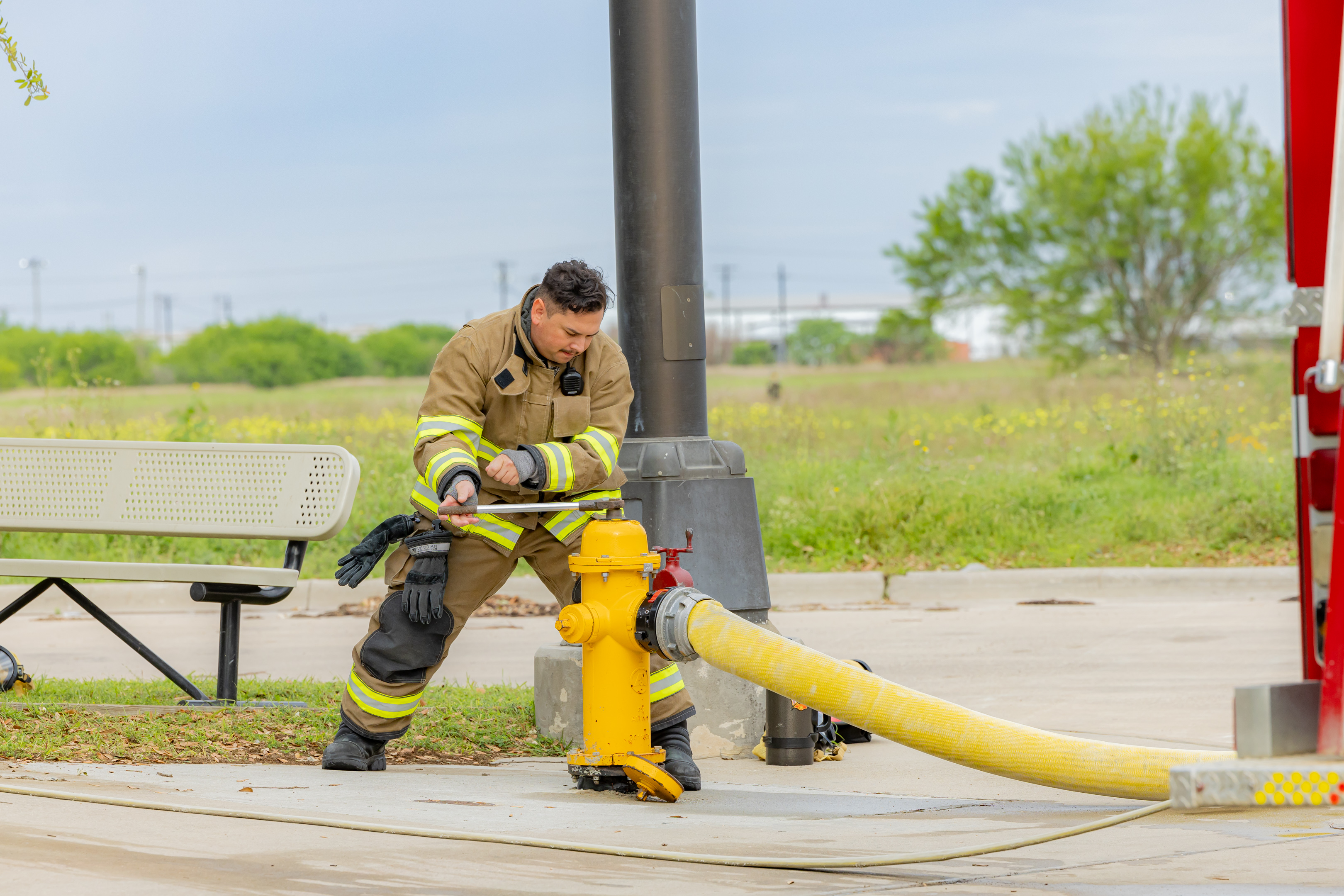 Firefighter opening fire hydrant